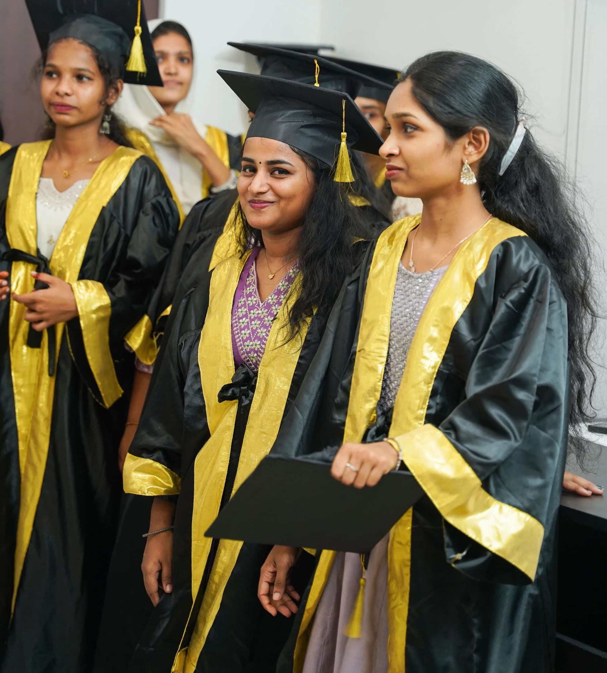 Finprov graduates in convocation gowns