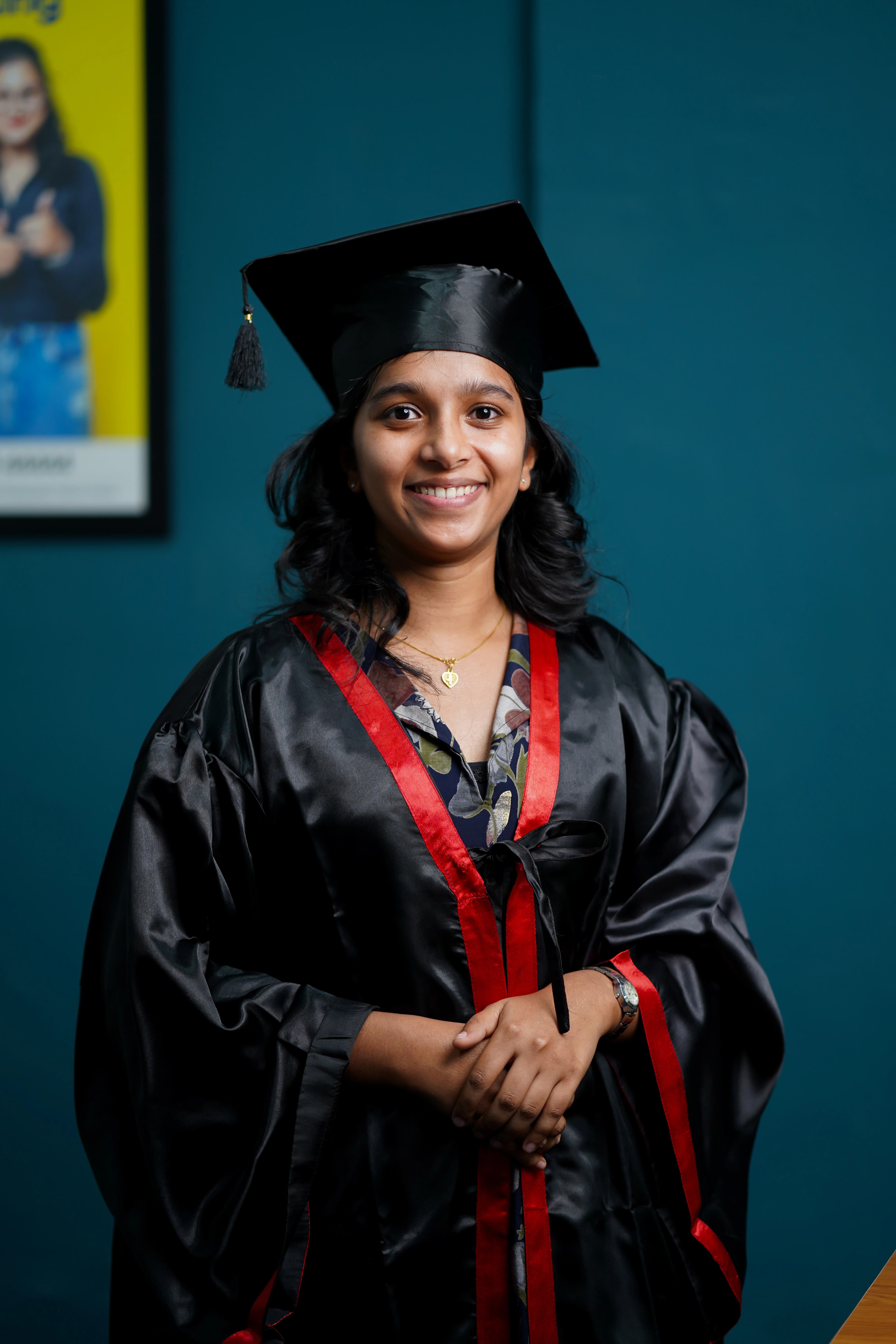 A Finprov graduate in a convocation gown