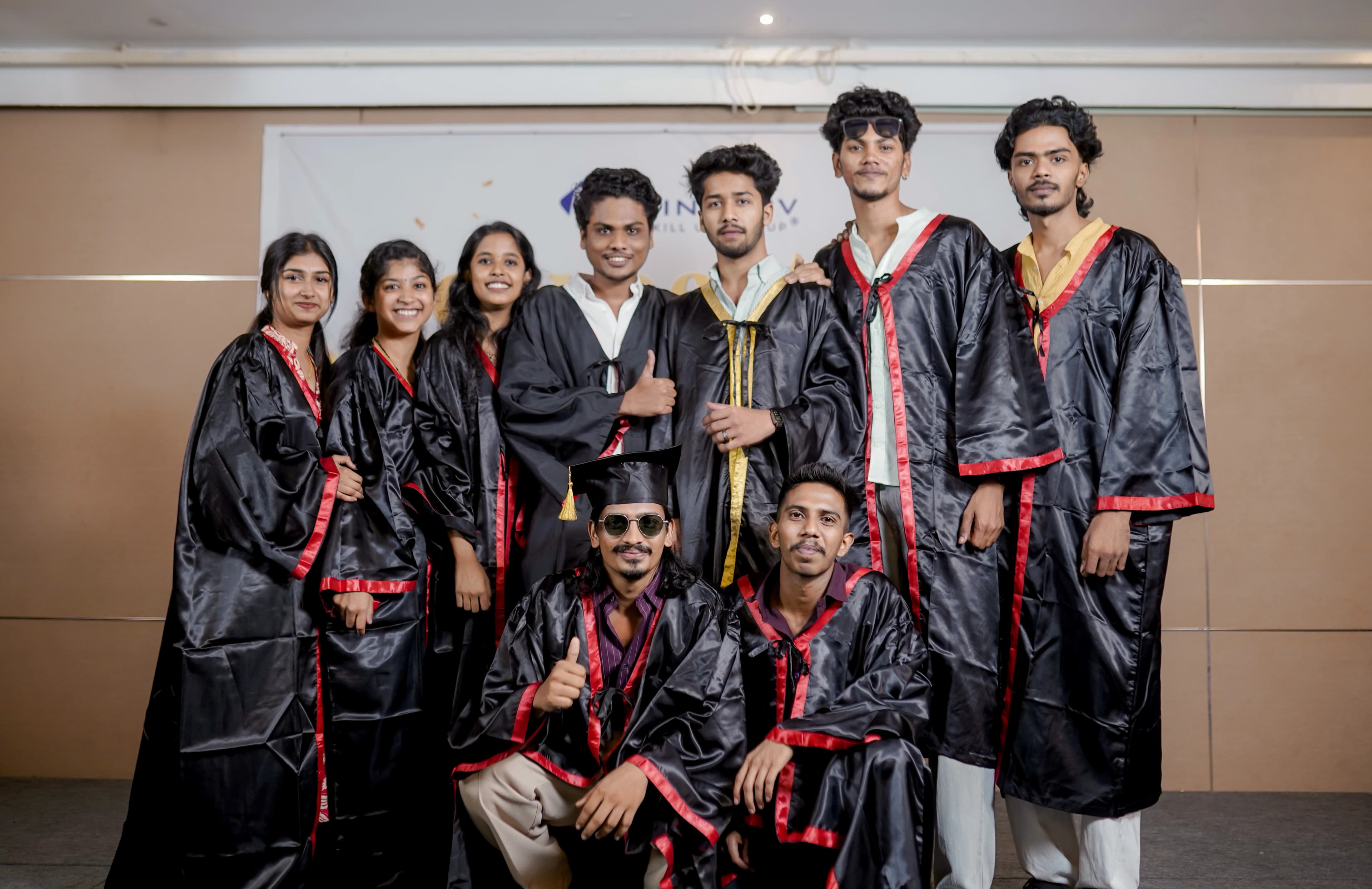 A group of Finprov graduates in convocation gowns